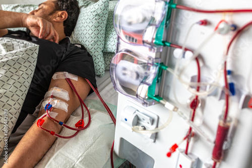 Germany, Bavaria, Munich, Portrait photograph of a man in the dialysis unit of a hospital