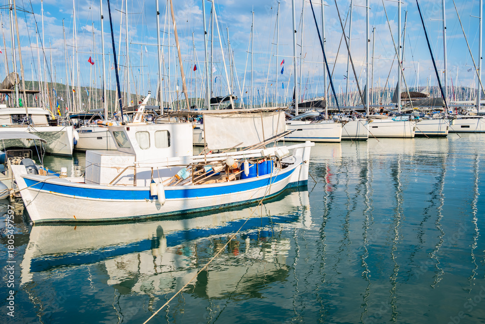 Fototapeta premium Old fishing boat anchoring in Lefkada port, Lefkada island, Greece