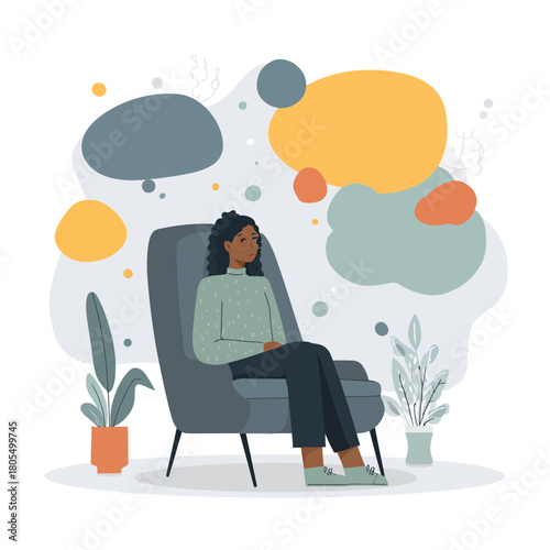Woman in armchair reflecting on thoughts regarding mental health