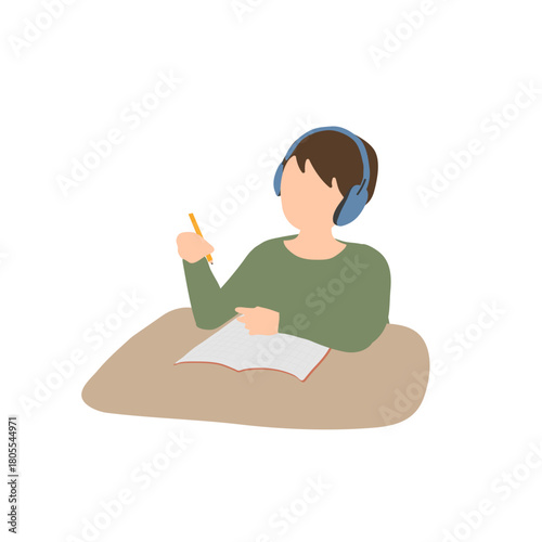 イヤーマフをつけて勉強する男の子