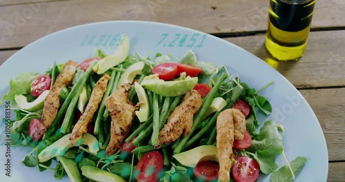 Camera pulling back, revealing pale blue plate; turquoise overlay sweeping showcasing salad and oil