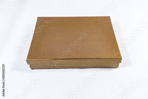 Plain metallic bronze and copper-toned gift box package present, brown square golden mockup material