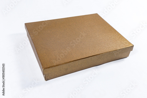 Plain metallic bronze and copper-toned gift box package present, brown square golden mockup material