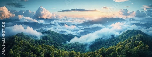Panoramic sunrise over mist-filled green mountain valleys with rolling forested ridges and dramatic cloudscape, evoking peaceful awe and calm