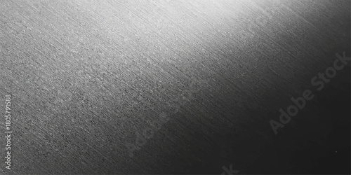 Dark gray metallic brushed steel surface texture with a light silver aluminum plate pattern as a modern backdrop design material