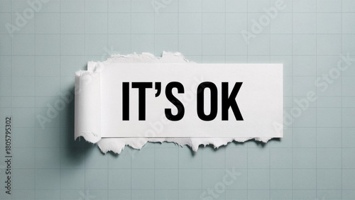 Torn paper with it's ok message against gray background