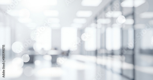 Fototapeta Naklejka Na Ścianę i Meble -  Bright abstract office interior background with soft white light and bokeh effects, creating a calm professional ambience with gentle glowing highlights and smooth visual depth across the space.