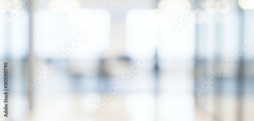 Bright abstract background of a modern interior space with soft focus, creating a calm luminous ambience with gentle glowing highlights and smooth visual depth throughout the scene.