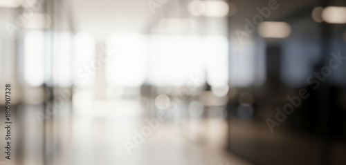 Wallpaper Mural Blurred modern office interior hallway with bright windows and light fixtures, creating a sleek professional workplace ambience with soft glowing tones and calm depth. Torontodigital.ca