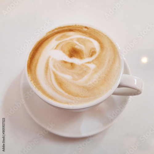 Creamy Hot Latte Coffee with Smooth Art Foam in Minimal White Setting