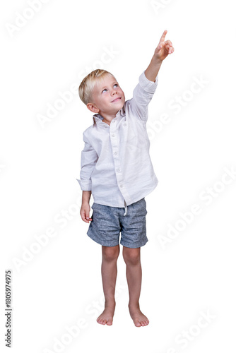 Smiling 5-year-old boy pointing up. Full length. Isolated on white background. Vertical.
