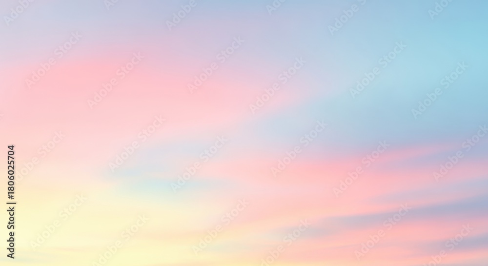 Obraz premium Captivating sunrise sky with pastel pink, blue, and yellow hues blending seamlessly creating a