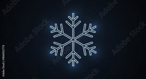 Glowing snowflake on a dark background, a symbol of winter and cold
