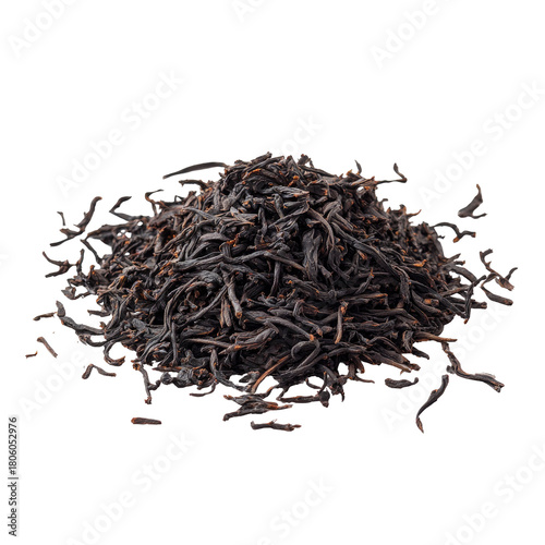 Pile of dark, dried tea leaves against a pure black background. Fine detail visible