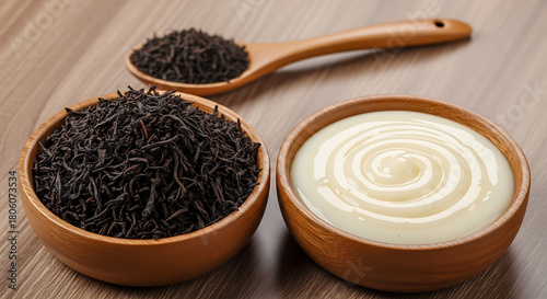 Black tea and condensed milk in wooden bowls transparent background