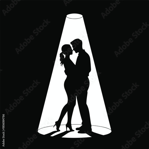 A captivating silhouette of a couple in a spotlight, showcasing their intimate embrace and creating a dramatic and romantic atmosphere