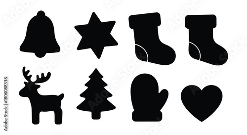 Collection of hand drawn black silhouette christmas ornaments and symbols on white background