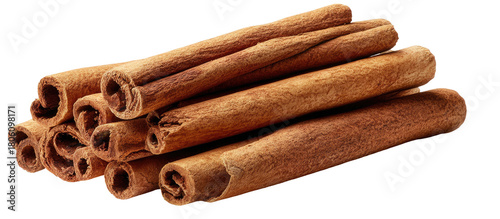 Rustic cinnamon sticks piled together, isolated on black