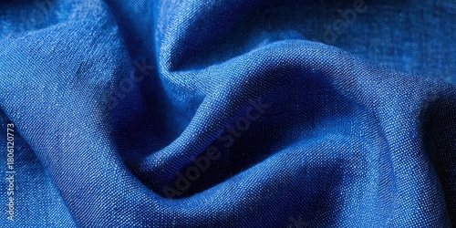 Close up texture of rippling deep blue woven fabric with light highlights