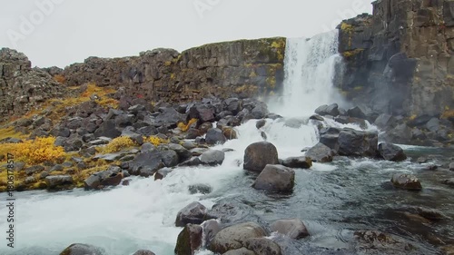 A slow shot of the majestic Öxarárfoss waterfall, located in the historic Þingvellir National Park in Southwest Iceland