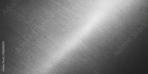Brushed metallic texture background: a gray aluminum surface design with a subtle light pattern