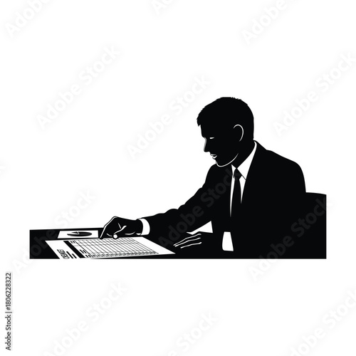Silhouette of a businessman in a suit working at a desk with papers