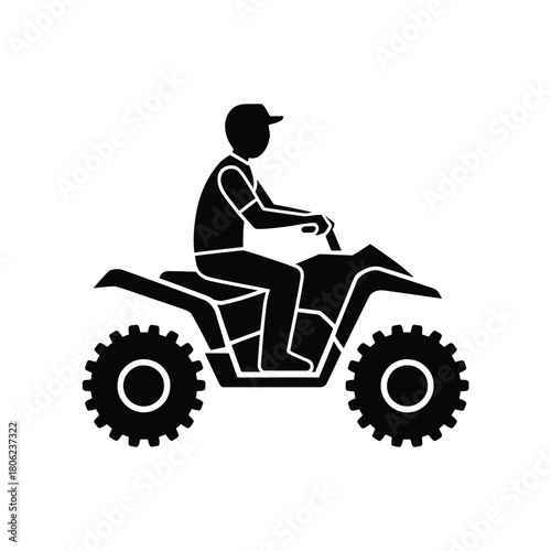 Silhouette of a person riding an all terrain vehicle