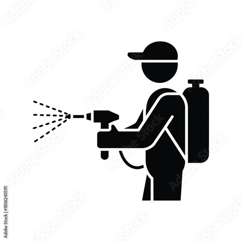 Pest control professional spraying with a backpack sprayer