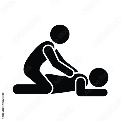 Person giving a massage to another person lying down