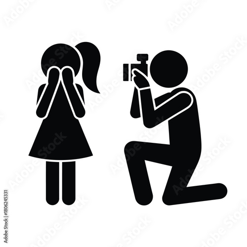 Photographer kneels to capture shy person s portrait