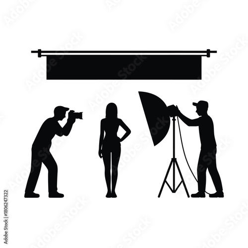 Silhouette of a photography studio session with a model and crew