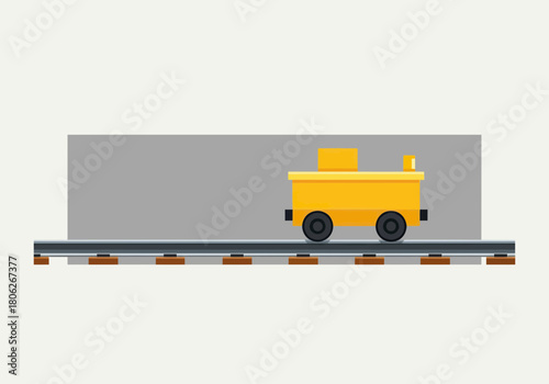 Yellow toy locomotive on railroad tracks.