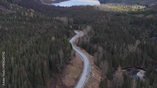 Aerial View of a Winding Mountain Road Leading to a Serene Lake in British Columbia, Canada