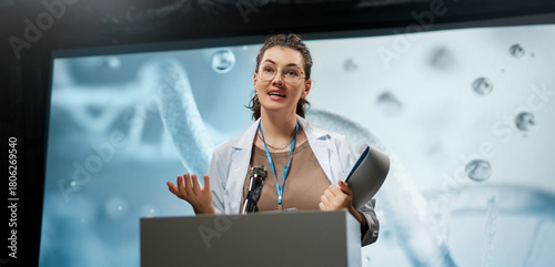woman is giving a presentation at a conference