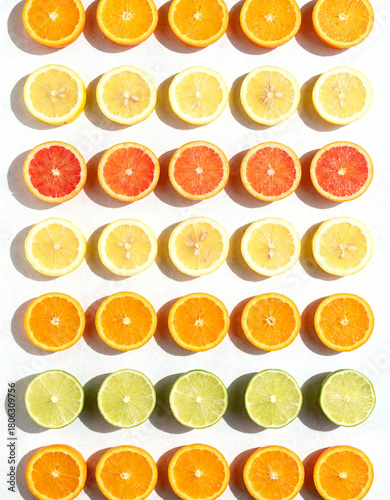 Citrus slices on white background. Flat lay, top view.