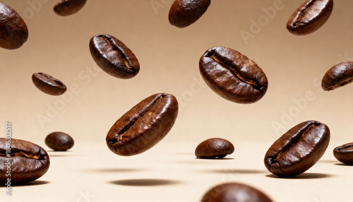 Flying coffee beans on beige background. Coffee beans levitate in the air.