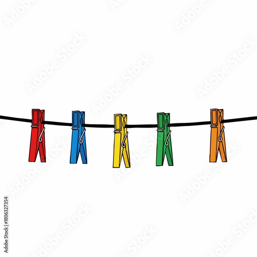 Colorful clothespins on clothesline against white backdrop for laundry drying. Laundry drying on rope with plastic clothes pins in many colors, including red, blue, and yellow.