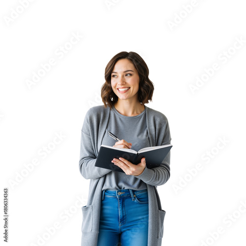 Confident Young Woman with Notebook and Pen: Wavy Brown Hair, Grey Cardigan, and Blue Jeans Against White Background — Radiating Approachability, Creativity, and Readiness for Ideas, Meetings, or Brai