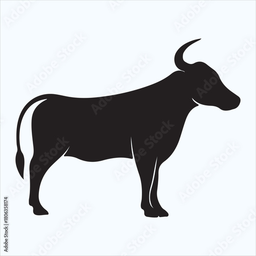 Black silhouette of a bull standing peacefully isolated on white background