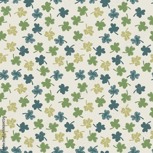 Seamless pattern of green clovers on a light background