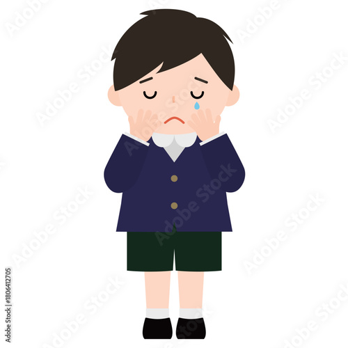 顔を覆って泣いている男の子