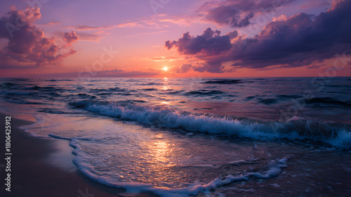 Fototapeta Naklejka Na Ścianę i Meble -  Orange and Purple Sunset over Quiet Beach and Gentle Sea