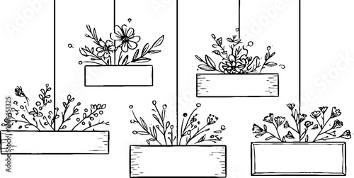 Minimalist hanging floral arrangements in geometric frames for artistic display