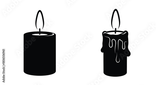 Two black silhouette candles one burning with melted wax detail