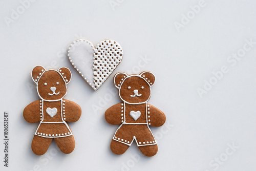 Gingerbread bears and heart decorated with white icing, copy space for text