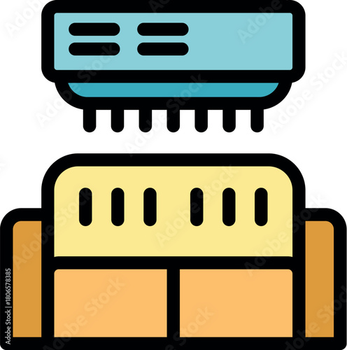 Air conditioner distributing cool air over a comfortable sofa in a living room, providing a pleasant home environment