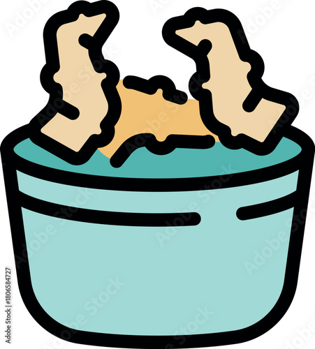 Ginger root pieces are soaking in a bowl of water, preparing them for use in a culinary recipe