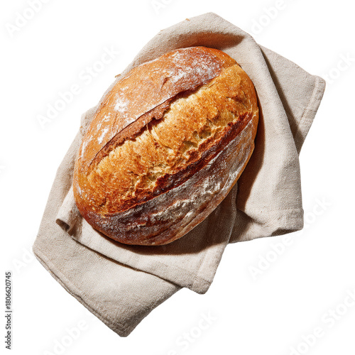 Freshly baked sourdough loaf resting on linen cloth