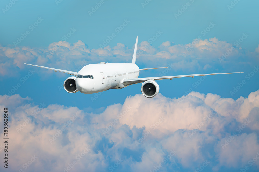 Naklejka premium Airplane flying over tropical sea at sunset