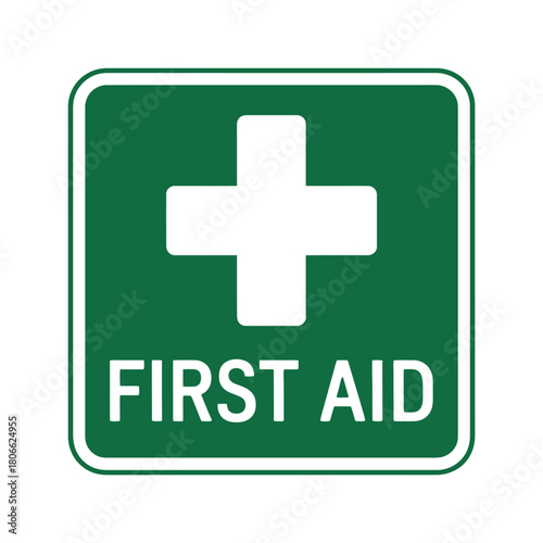 A green square sign displays a white cross and the words FIRST AID in white text.